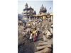 MANIKARNIKA, INDIA, BODY BEING BATHED IN GANGES RIVER BEFORE CREMATION